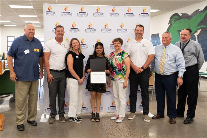 Chandler Education Foundation Board of Directors with a scholarship winner at Basha High School.