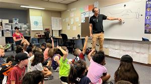 Engineer talking to students 