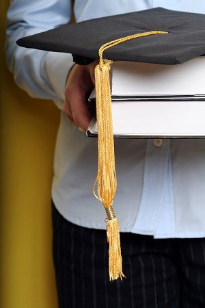 Graduation cap and textbooks