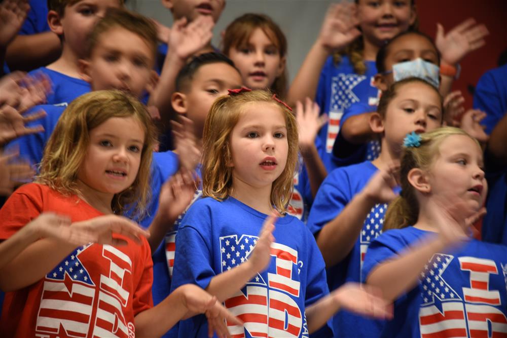 Second graders singing patriotic songs