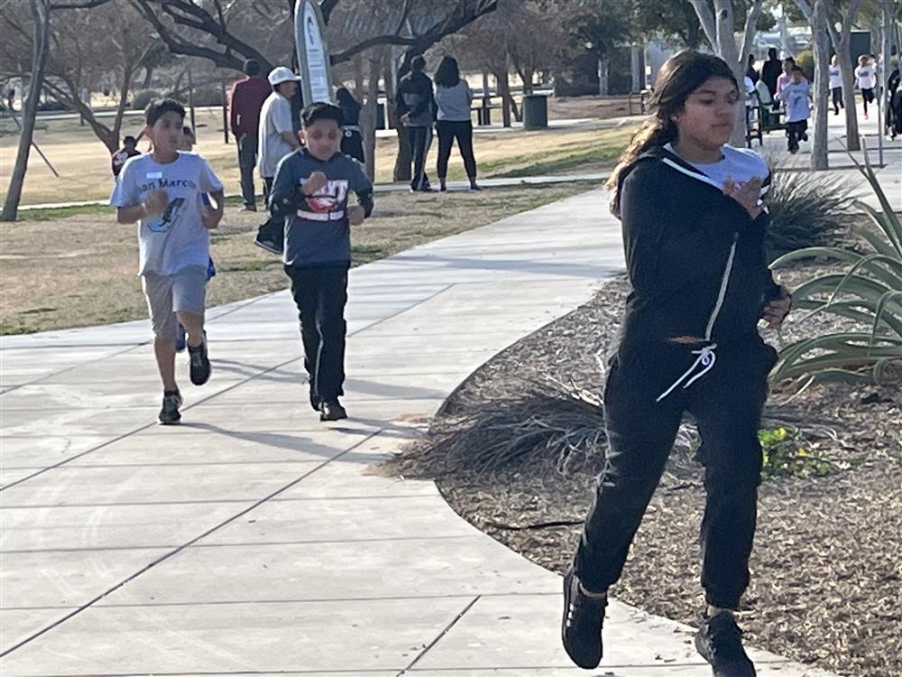 Running Club race students running.