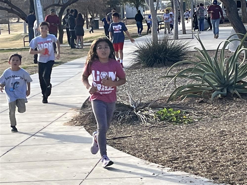 Running Club race students running.