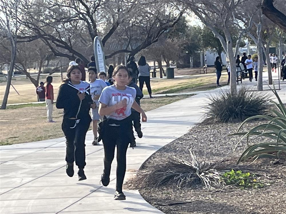 Running Club race students running.