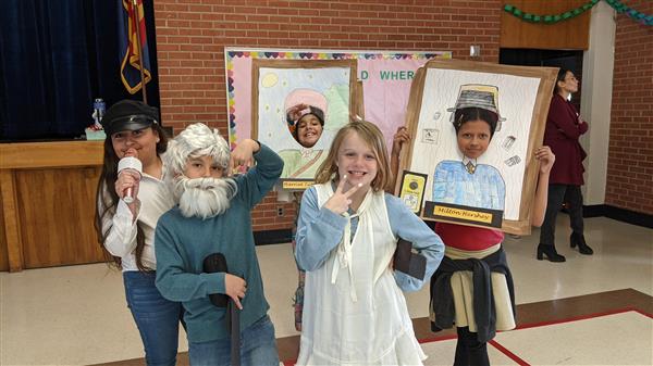 Students show important historical figures. 