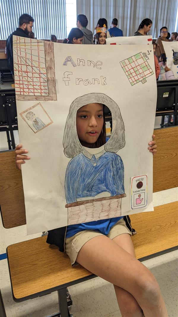 Students show important historical figures. 