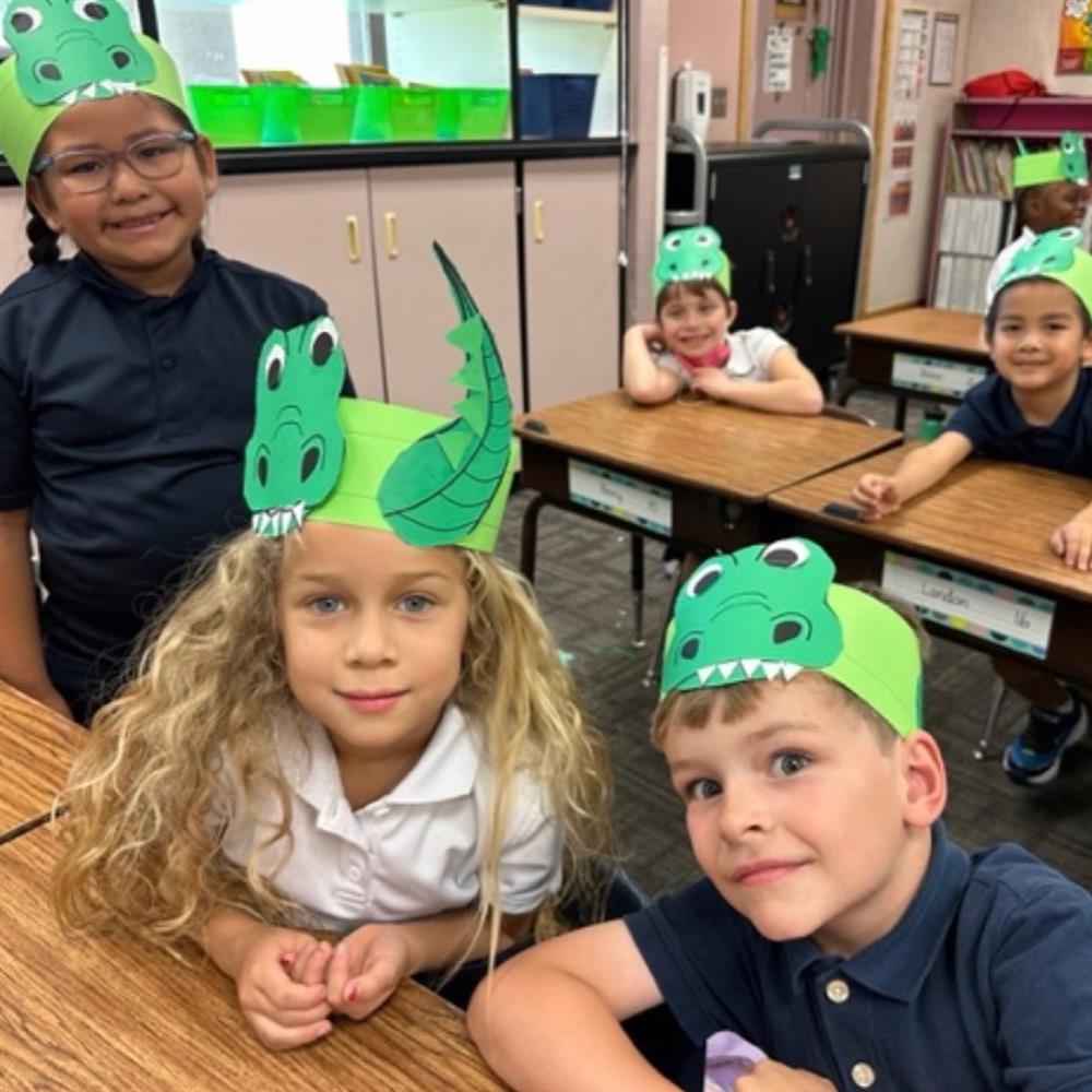 Students wear paper gator hats at Chandler Traditional Academy Goodman