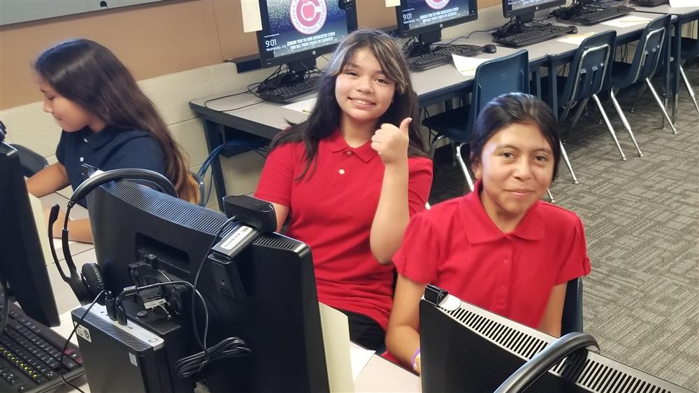 Students smile at the camera at San Marcos Elementary School