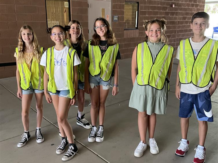 Sixth graders wearing vests help new students at Tarwater Elementary School