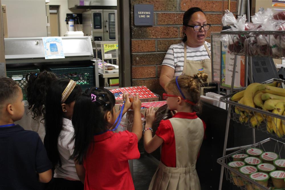 Students show their identification at a Chandler Unified Nutrition employee