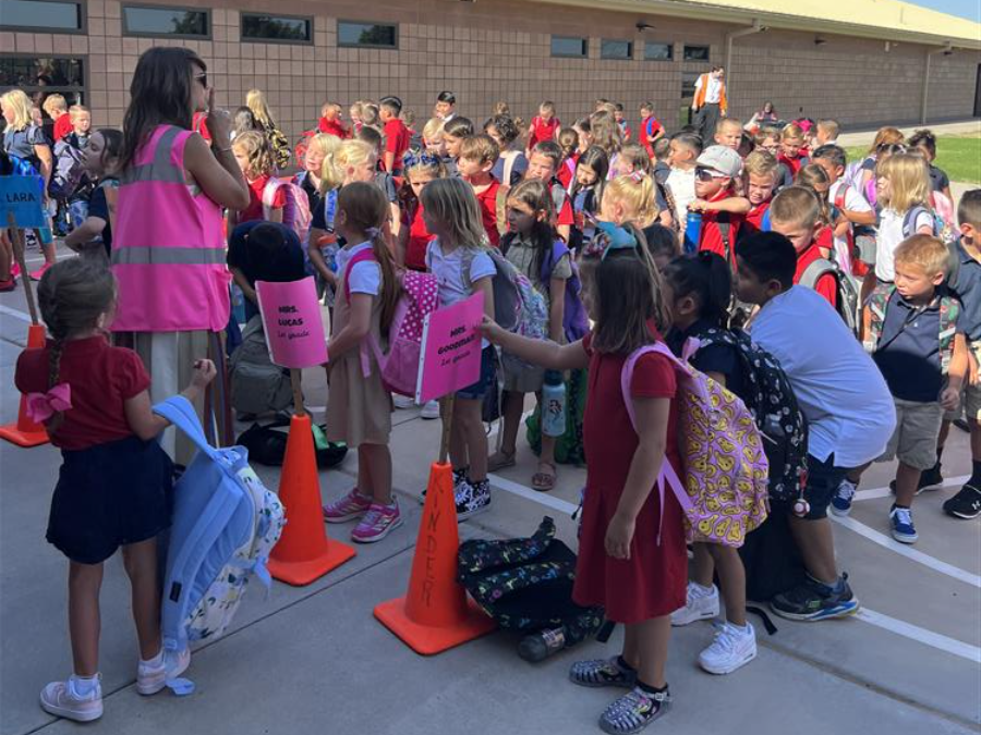 Photo of students preparing to walk inside Auxier Elementary School