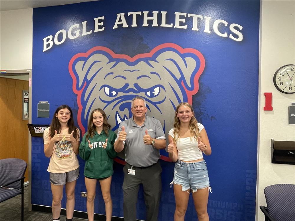 Superintendent Frank Narducci smiles with students at Bogle Junior High