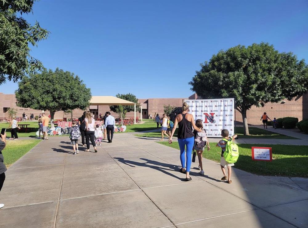 Parents arrive at Navarrete Elementary School with their kids