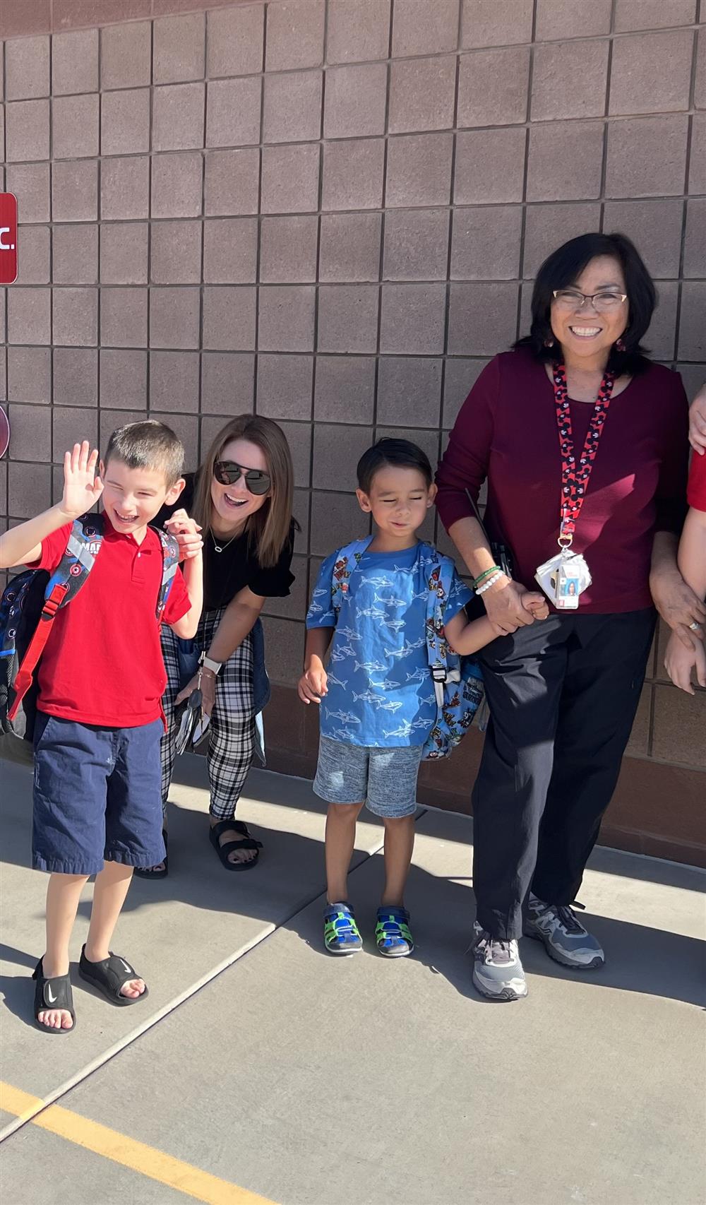 A student waves at the camera at Auxier Elementary School