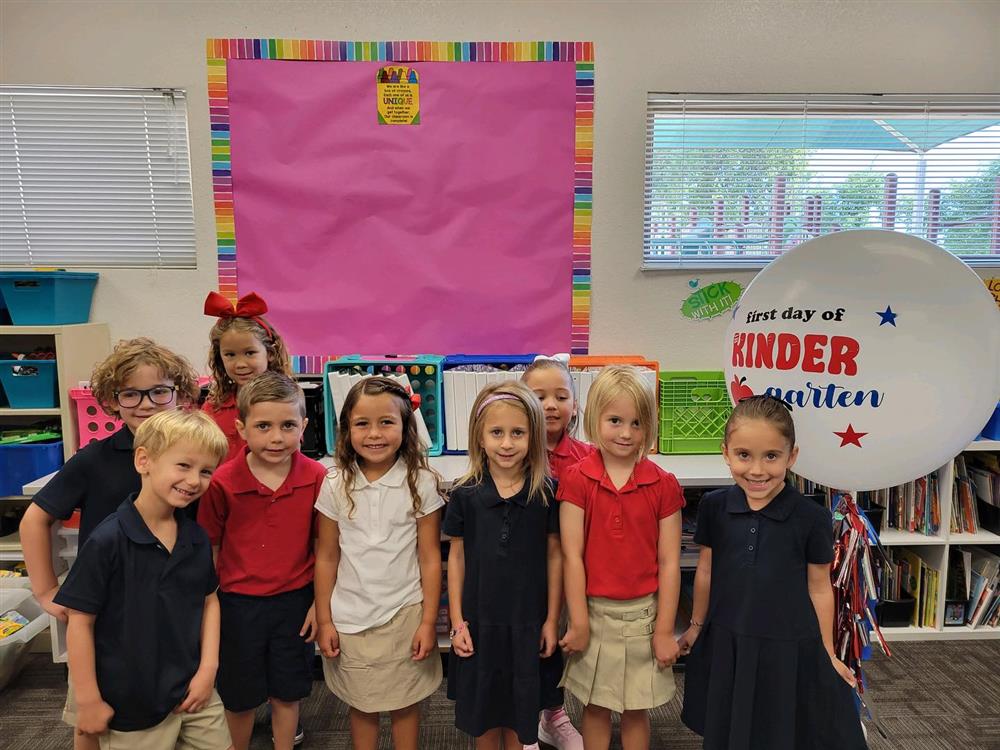 kindergarten students smile for the camera at Chandler Traditional Academy Liberty