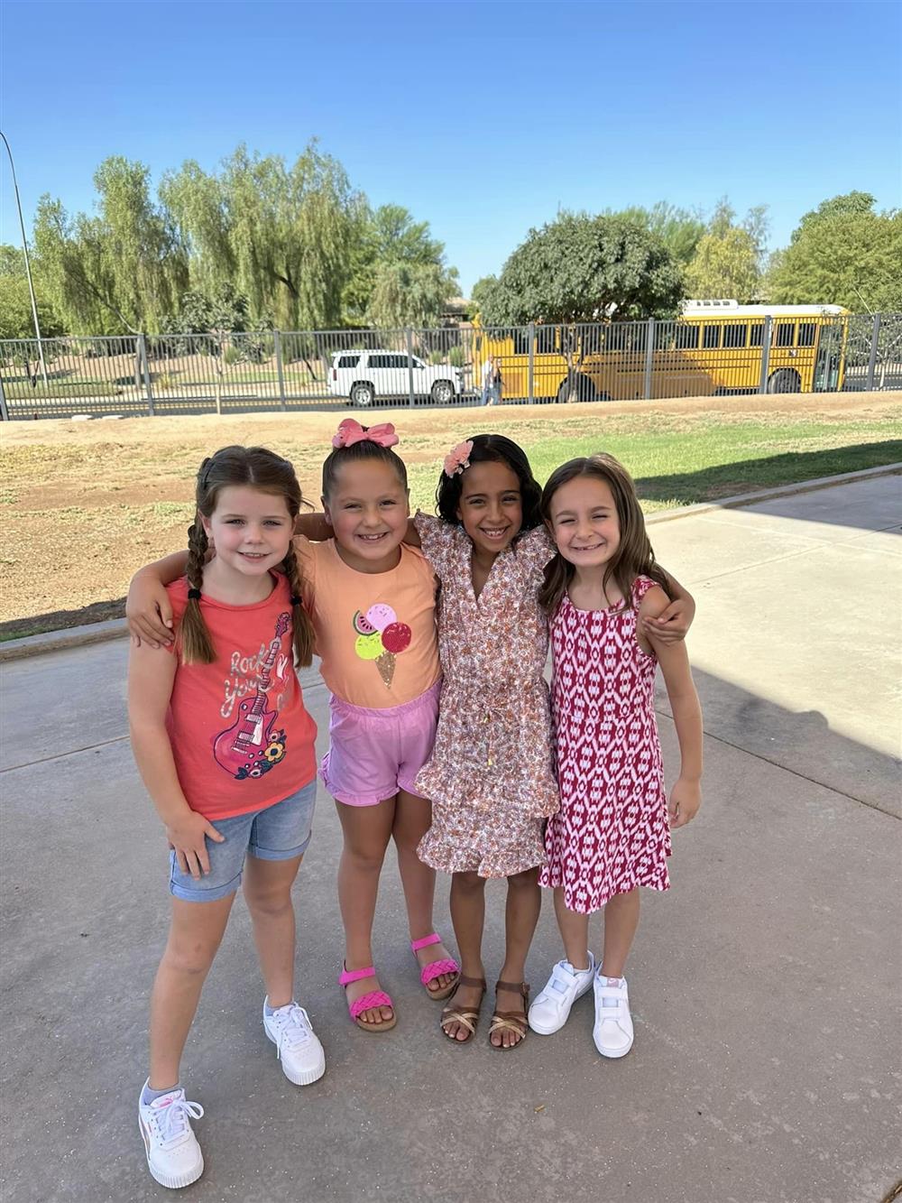 Four friends pose for a photo at Haley Elementary School