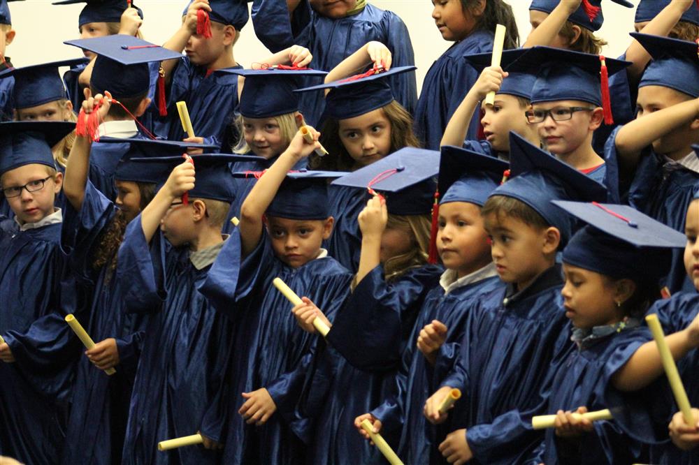 A group photo of students at kindergarten graduation