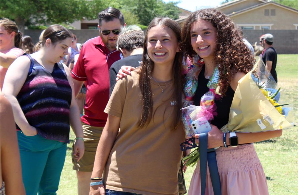 Two sixth grade students smile for the camera