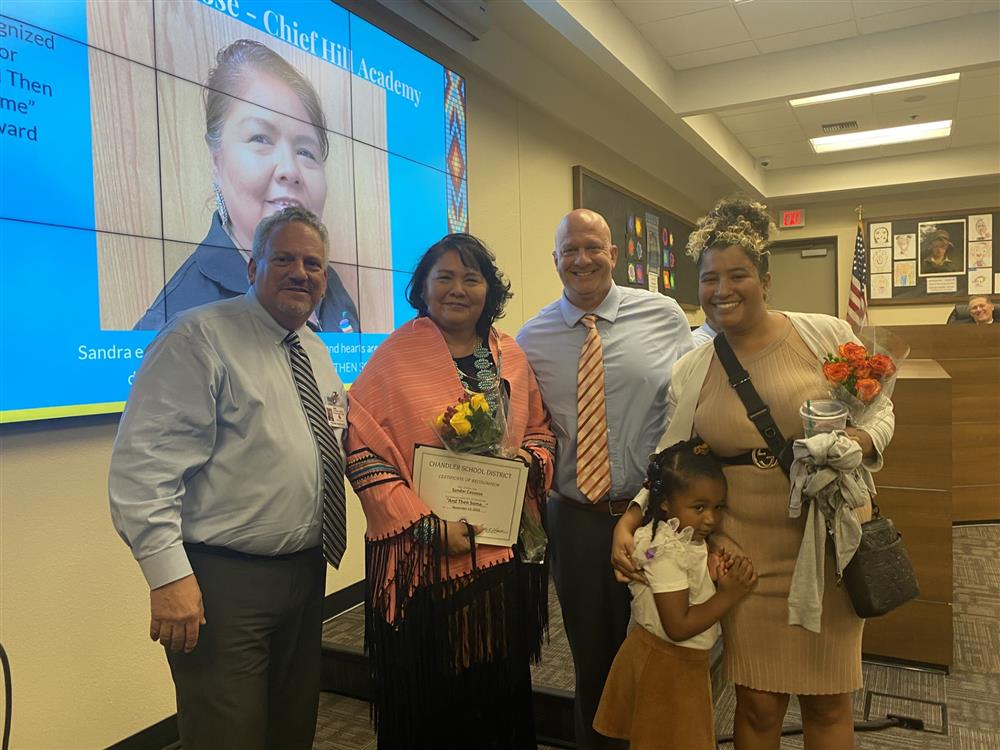 Mrs. Casoose receiving her award